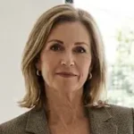 Professional portrait of Lysa Benjamin, Elite Bathroom Design Specialist at My Blue Bath, wearing a brown patterned blazer.