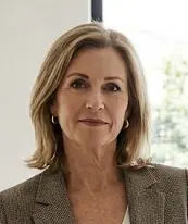 Professional portrait of Lysa Benjamin, Elite Bathroom Design Specialist at My Blue Bath, wearing a brown patterned blazer.