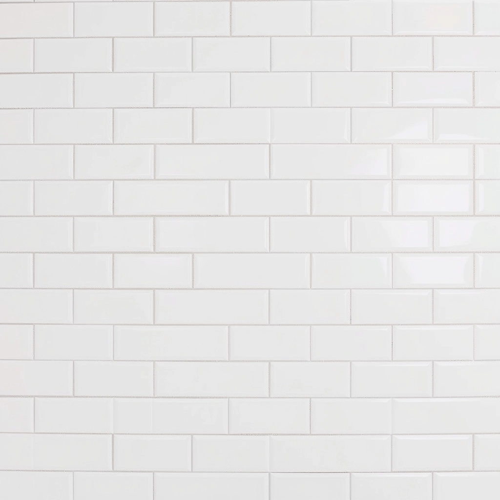 A clean, bright bathroom featuring white ceramic subway tiles, a popular and affordable choice for shower walls.